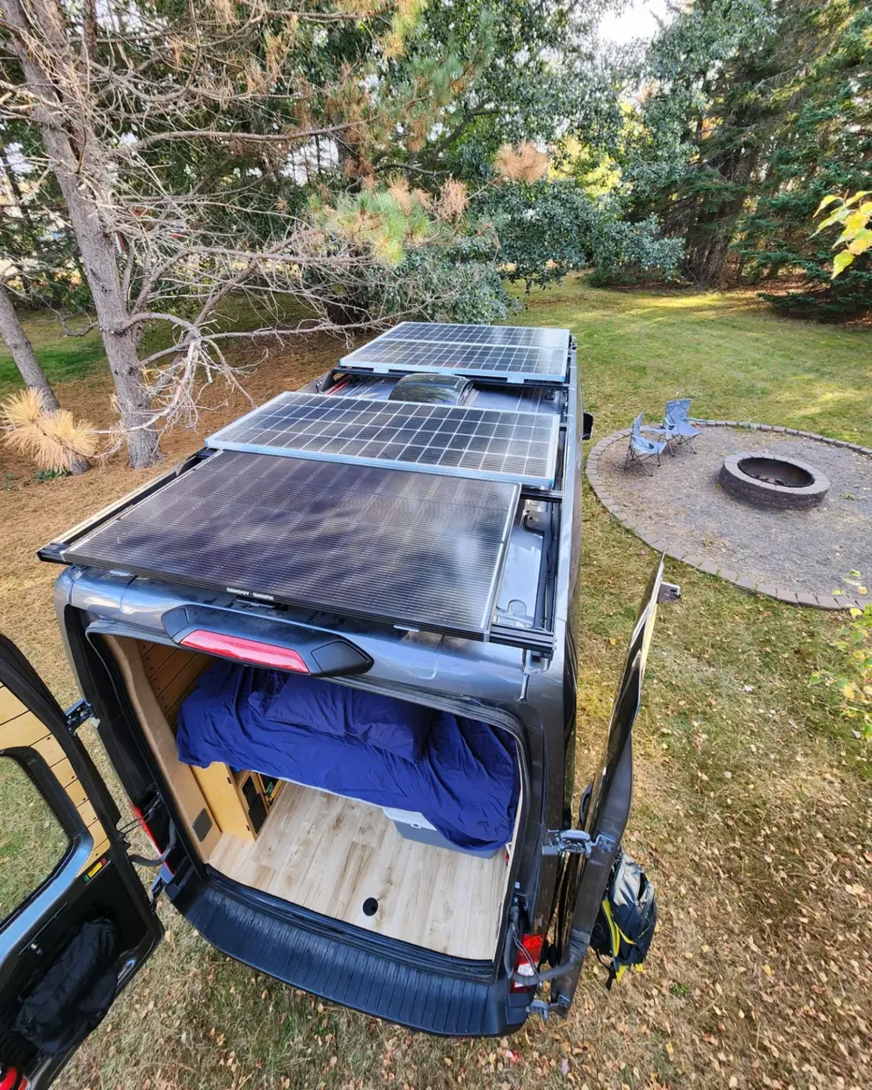 Renogy ShadowFlux solar panels installed across the roof of a camper van